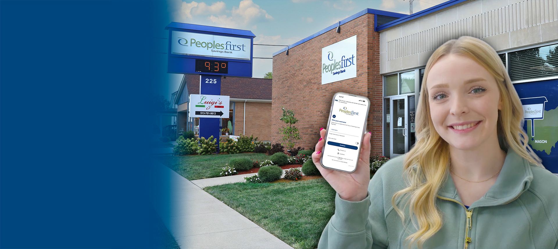 Woman holding cell phone in front of bank building